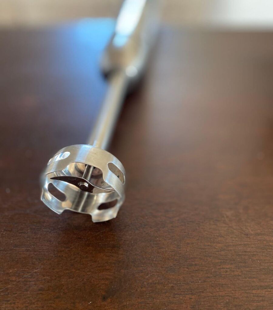 Close up of an immersion blender blade.