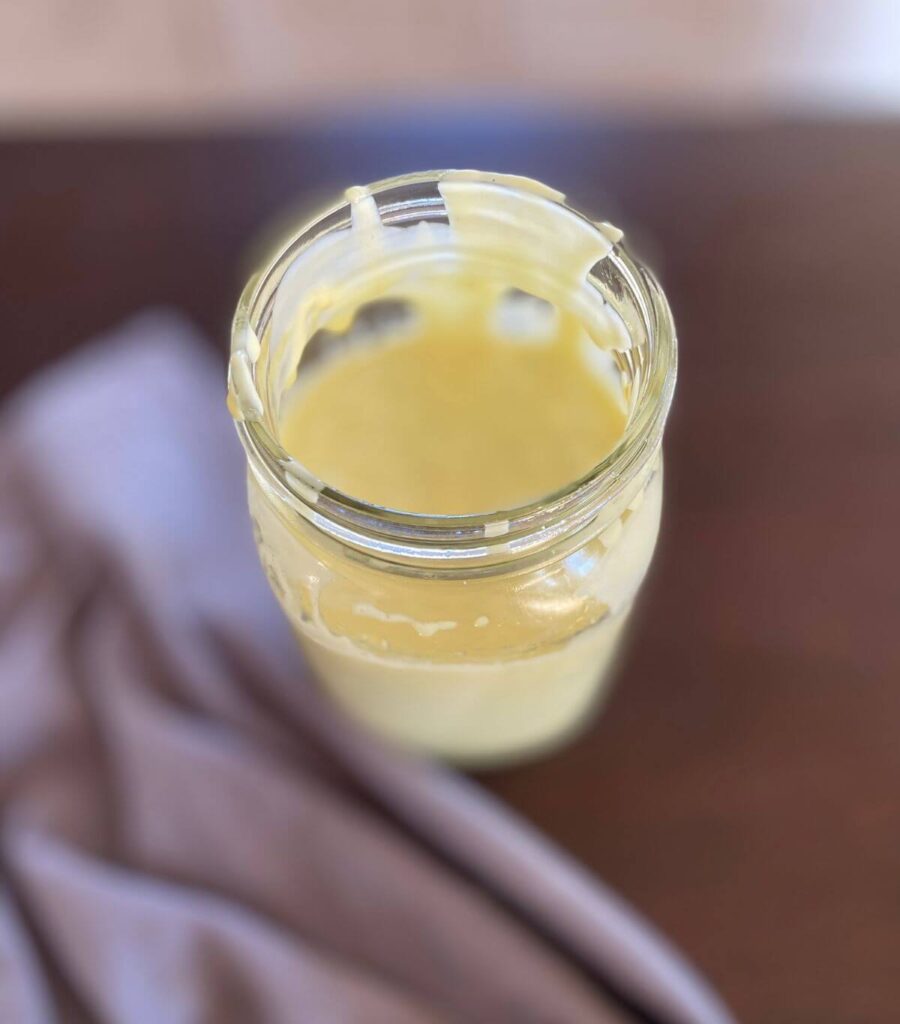 Overhead shot of a jar of homemade mayo.