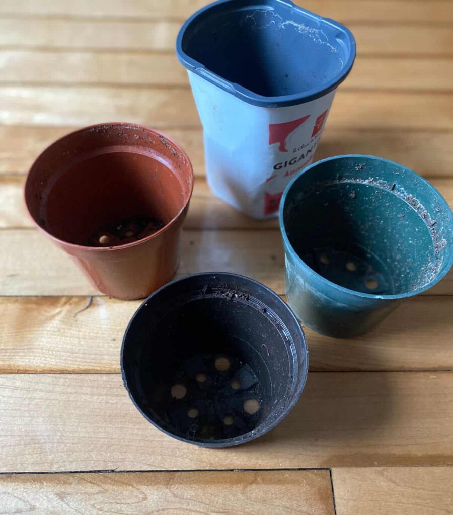Four various kinds of small empty flower/seed starting pots
